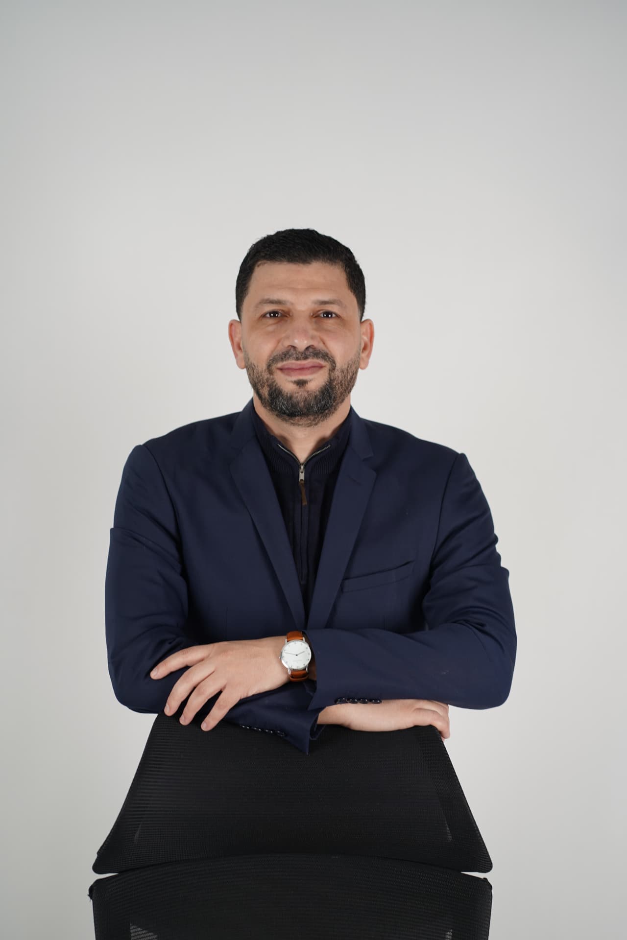 El Hassen — navy blazer portrait